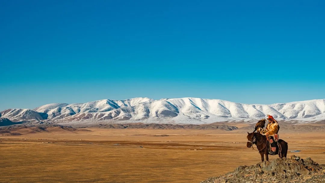 Mongolia di komunitas togel - horse rider snowy plains Mongolia
